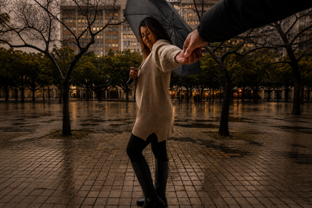 Cape Town in winter with a couple exploring the rainy city centre under an umbrella.